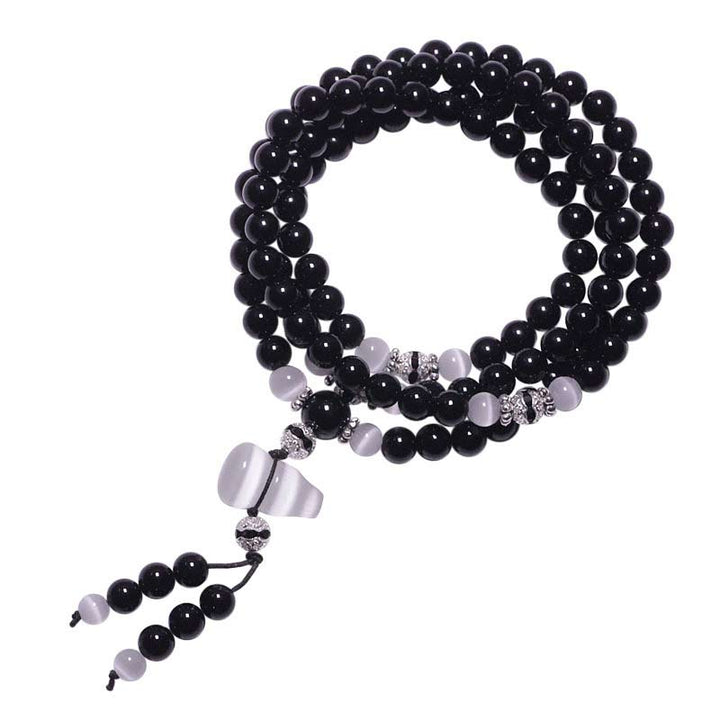 Bracelet de méditation en perles de cristal blanc et onyx noir Buddha Stones