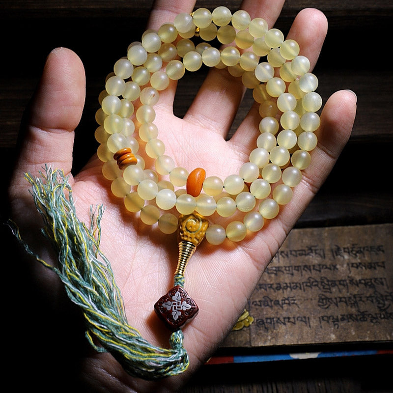Bracelet porte-bonheur en ambre avec 108 Buddha Stones de Mala en corne de mouton du Tibet