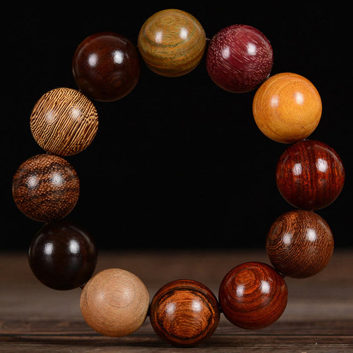 Bracelet de guérison et de protection en bois de santal multicolore Buddha Stones