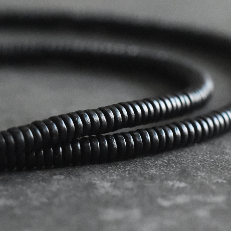 Bracelet multicouches en bois d'ébène et cuivre avec Buddha Stones