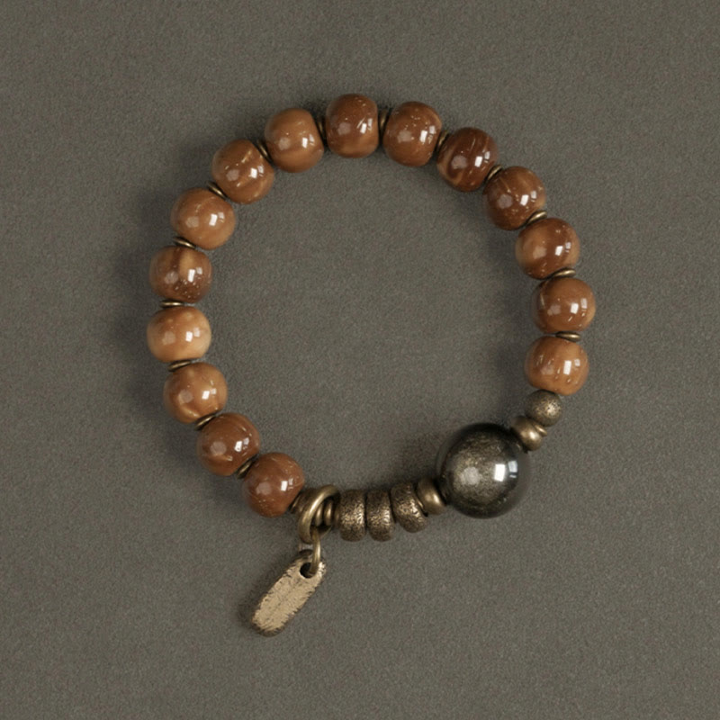 Bracelet porte-bonheur en cuivre et obsidienne dorée avec Buddha Stones de Kuka et œil de tigre