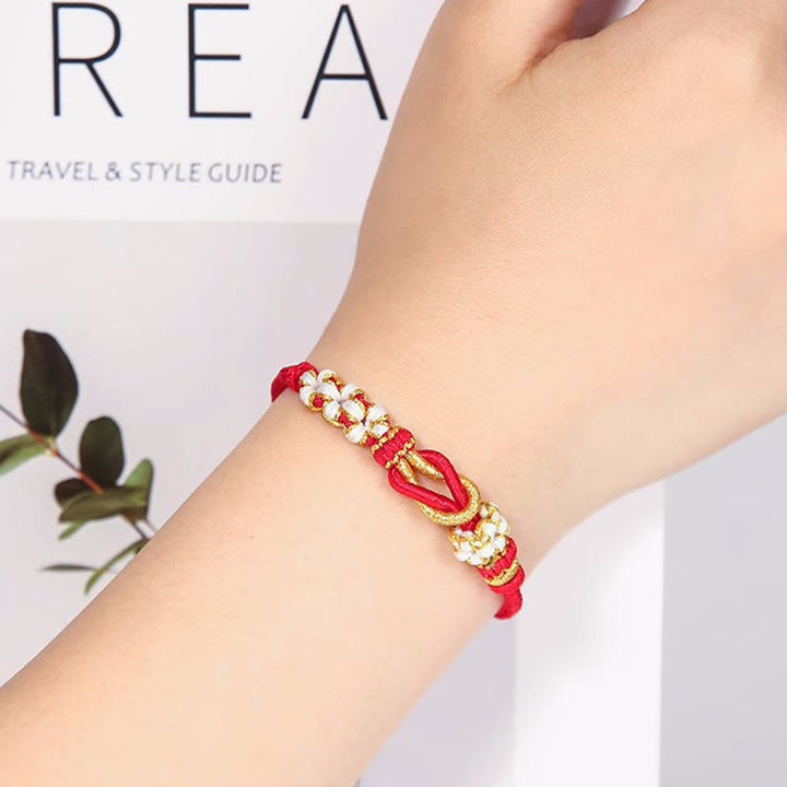 Bracelet de protection porte-bonheur fait main en Buddha Stones avec nœud en fleur de pêcher à huit fils