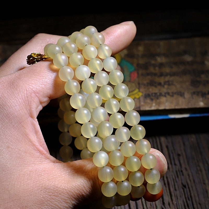 Bracelet porte-bonheur en ambre avec 108 Buddha Stones de Mala en corne de mouton du Tibet