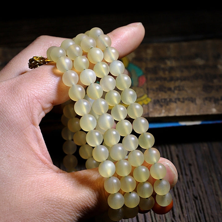Bracelet porte-bonheur en ambre avec 108 Buddha Stones de Mala en corne de mouton du Tibet