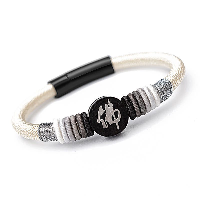 Bracelet en corde fait main en ébène avec personnage de Bouddha de Buddha Stones