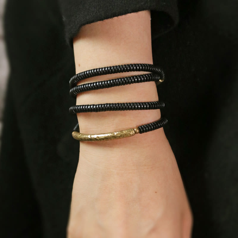 Bracelet multicouches en bois d'ébène et cuivre avec Buddha Stones