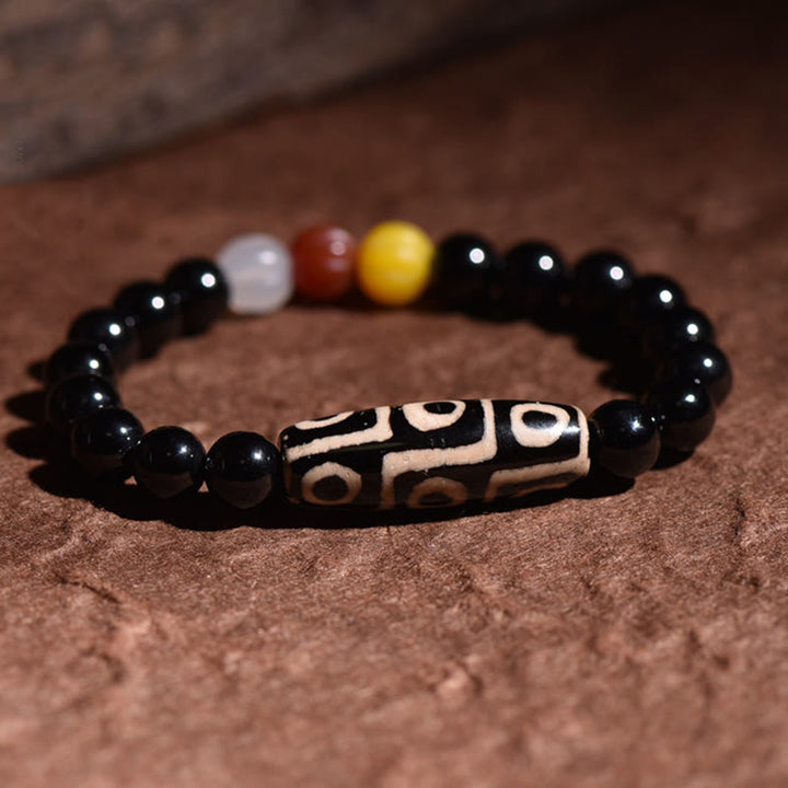 Bracelet de pouvoir de richesse en perles dzi naturelles tibétaines à neuf yeux Buddha Stones