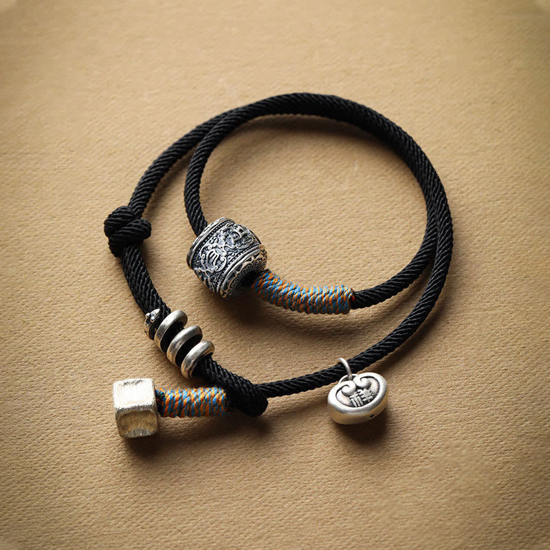 Bracelet en corde double enroulé en Buddha Stones fait à la main avec amulette de bon augure sculptée Om Mani Padme Hum