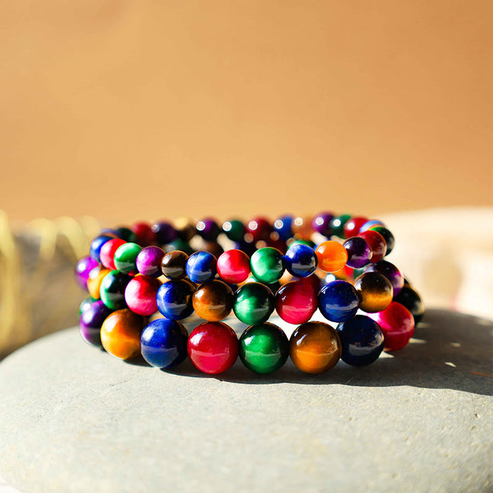 Bracelet courageux et résolu en œil de tigre avec Buddha Stones
