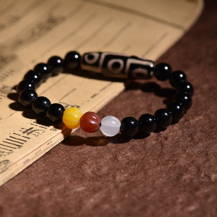 Bracelet de pouvoir de richesse en perles dzi naturelles tibétaines à neuf yeux Buddha Stones