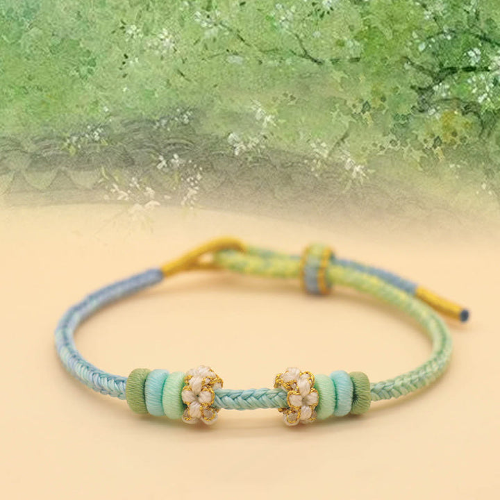Bracelet tressé fait main en corde porte-bonheur avec nœud de paix à huit fils et nœud de fleur de pêcher en Buddha Stones - Printemps plein de jardins (bleu vert) (tour de poignet 14-18 cm) - image 4