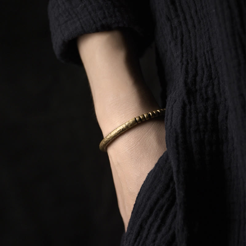 Bracelet porte-bonheur en perles de cuivre et de laiton au design simple Buddha Stones