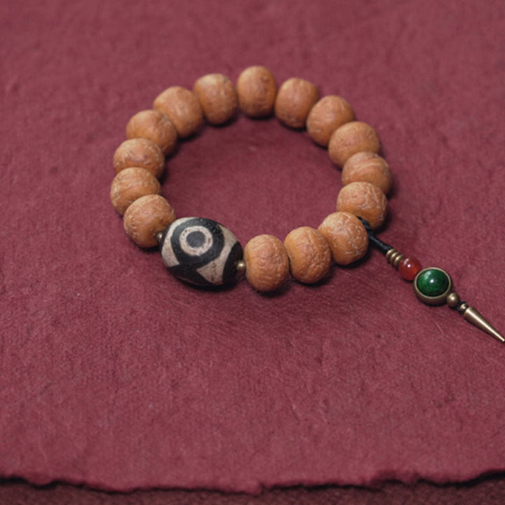 Bracelet Mala en perles de graines de Bodhi Dzi en pierres de Buddha Stones tibétaines avec breloque de paix