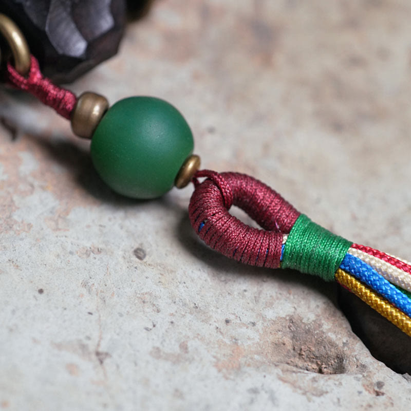 Bracelet Mala en bois d'ébène et cuivre avec Buddha Stones et pompon de paix