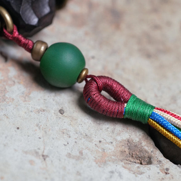 Bracelet Mala en bois d'ébène et cuivre avec Buddha Stones et pompon de paix