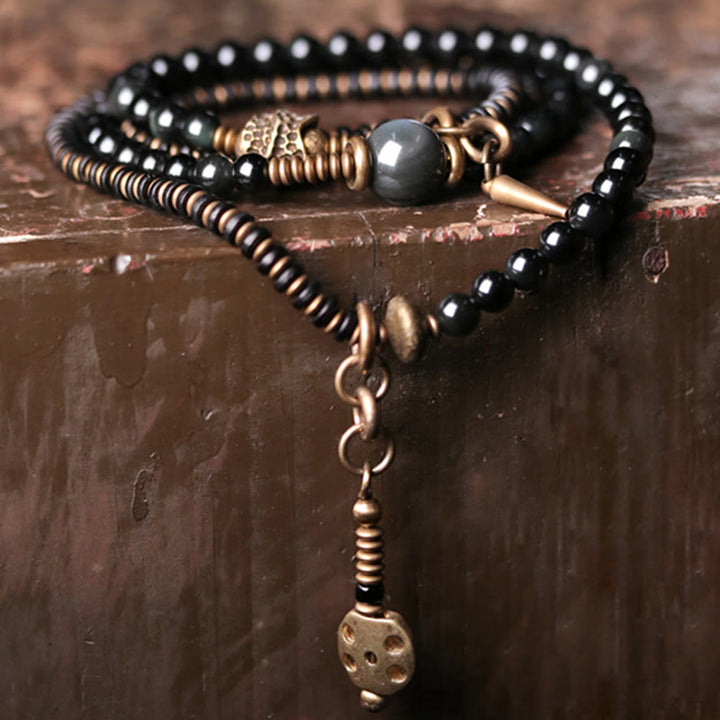Bracelet multicouche positif en cuivre et bois d'ébène avec Buddha Stones arc-en-ciel obsidienne