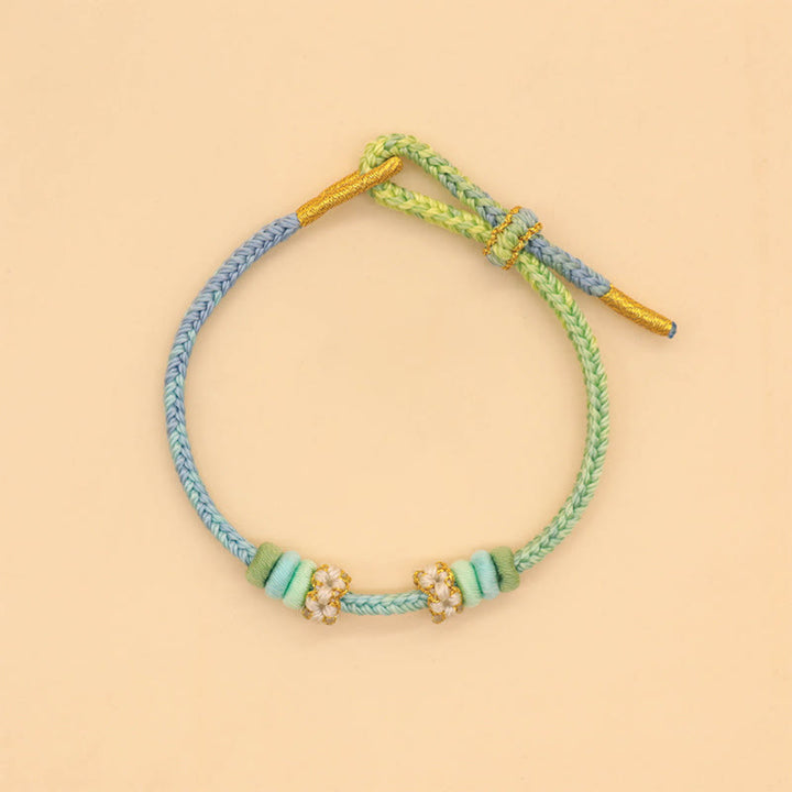 Bracelet tressé fait main en corde porte-bonheur avec nœud de paix à huit fils et nœud de fleur de pêcher en Buddha Stones - image 5