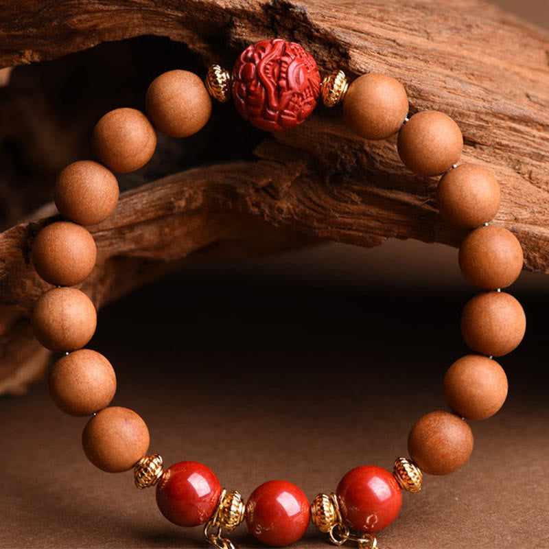 Bracelet Buddha Stones en bois de pêche et cinabre naturel avec pompons de richesse PiXiu