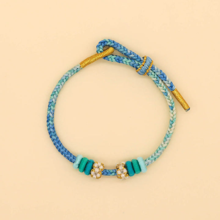 Bracelet tressé fait main en corde porte-bonheur avec nœud de paix à huit fils et nœud de fleur de pêcher en Buddha Stones - image 11