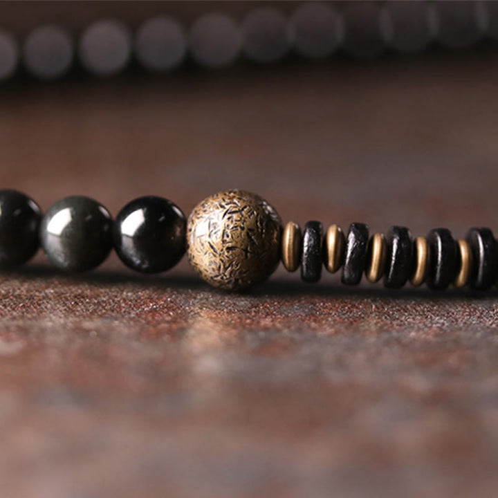 Bracelet multicouche positif en cuivre et bois d'ébène avec Buddha Stones arc-en-ciel obsidienne