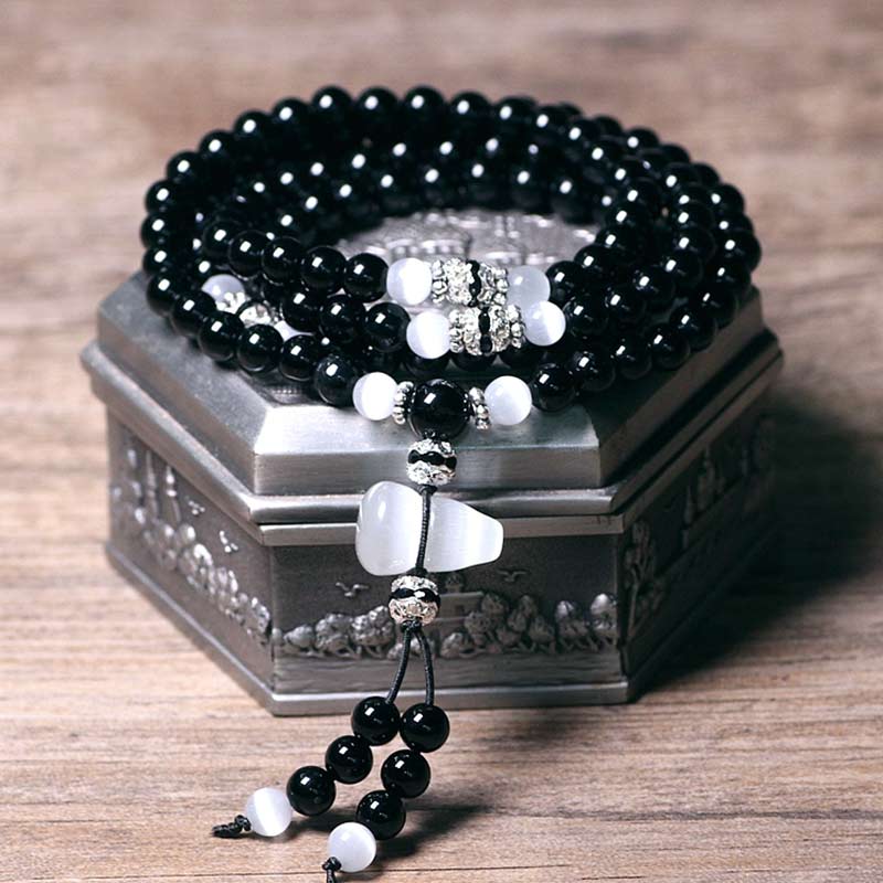 Bracelet de méditation en perles de cristal blanc et onyx noir Buddha Stones