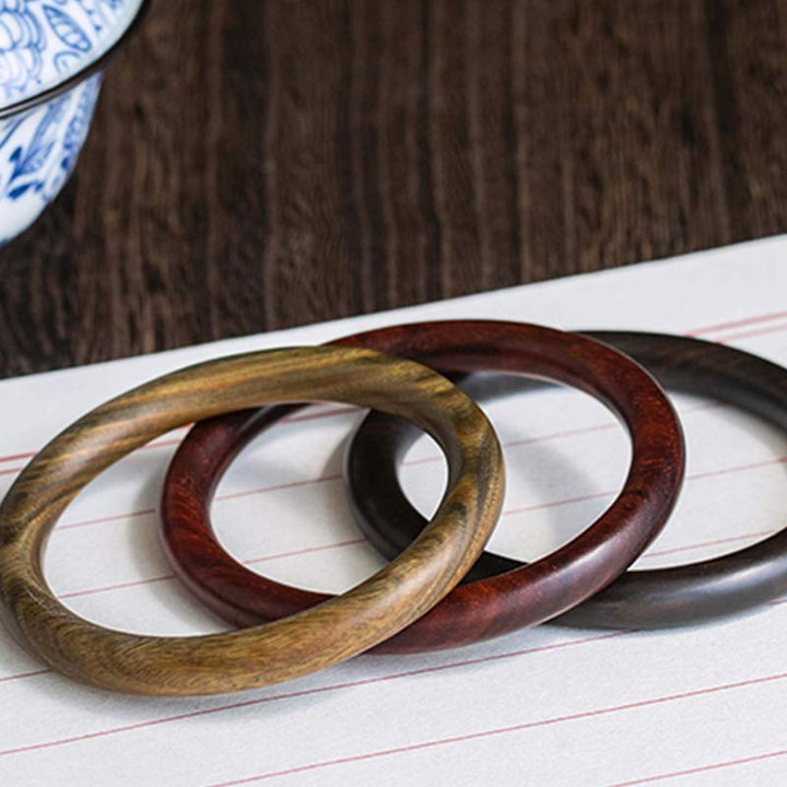 Bracelet de protection tibétain en petites feuilles de bois de santal rouge et ébène avec Buddha Stones