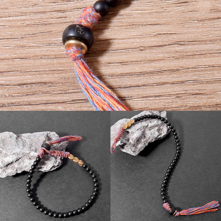 Bracelet à pampilles en onyx noir tibétain fait main avec Buddha Stones