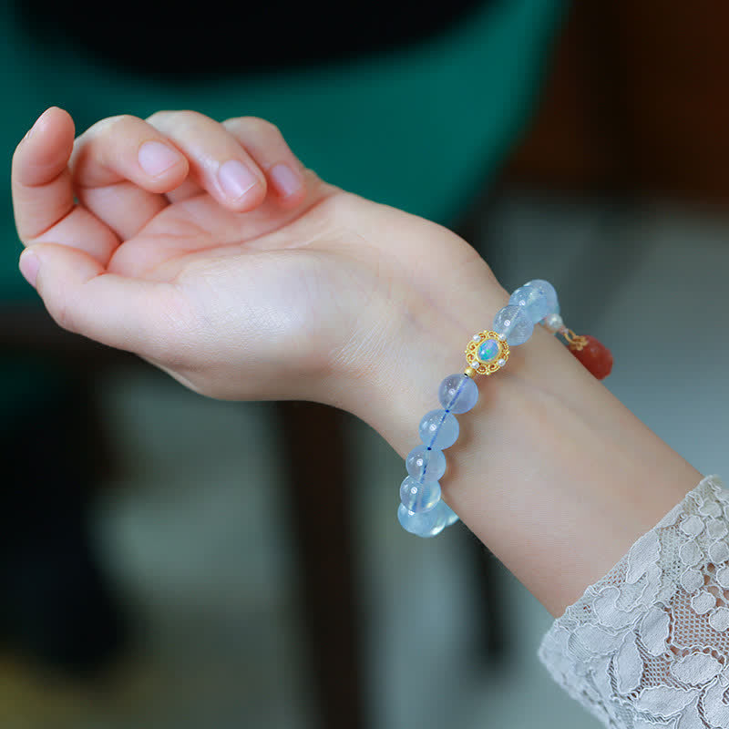 Bracelet de charme de guérison en perles d'agate rouge et aigue-marine naturelles de Buddha Stones
