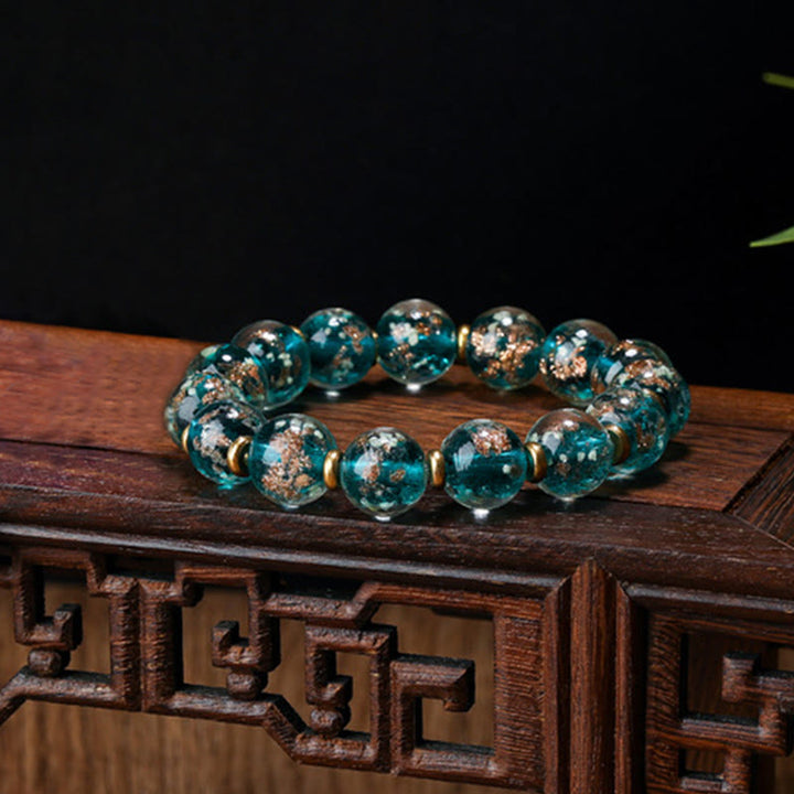 Bracelet de réussite en perles de verre Liuli fluorescentes lumineuses avec breloque de famille de bêtes avaleuses en or et Buddha Stones