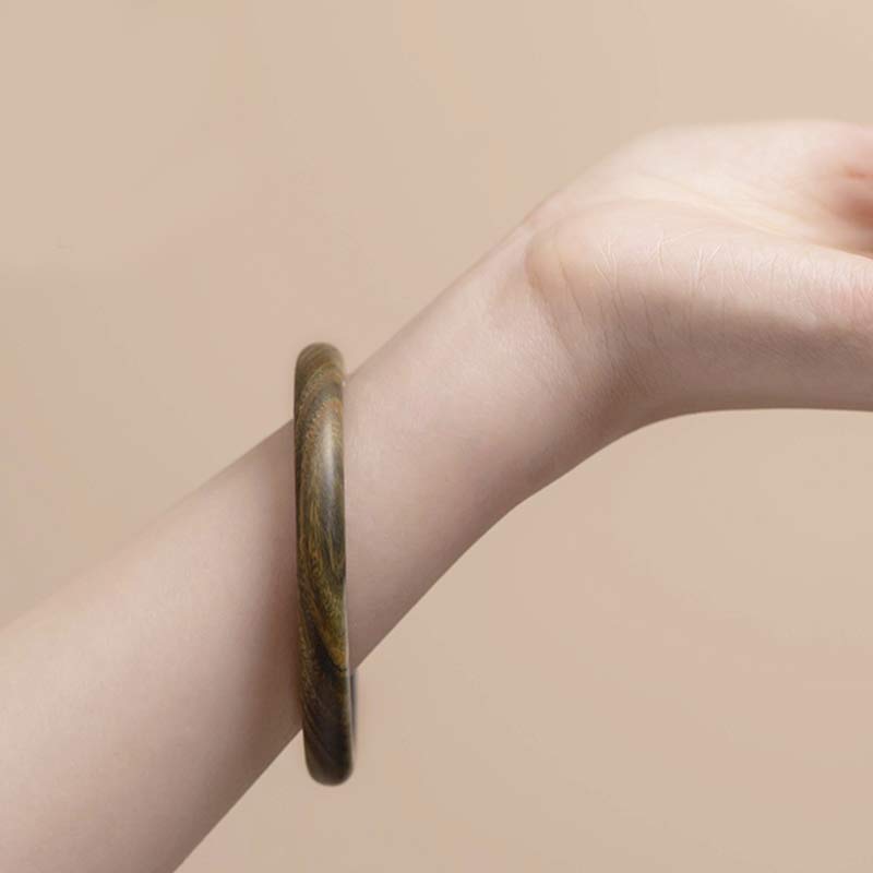 Bracelet de protection tibétain en petites feuilles de bois de santal rouge et ébène avec Buddha Stones