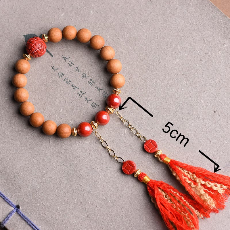 Bracelet Buddha Stones en bois de pêche et cinabre naturel avec pompons de richesse PiXiu