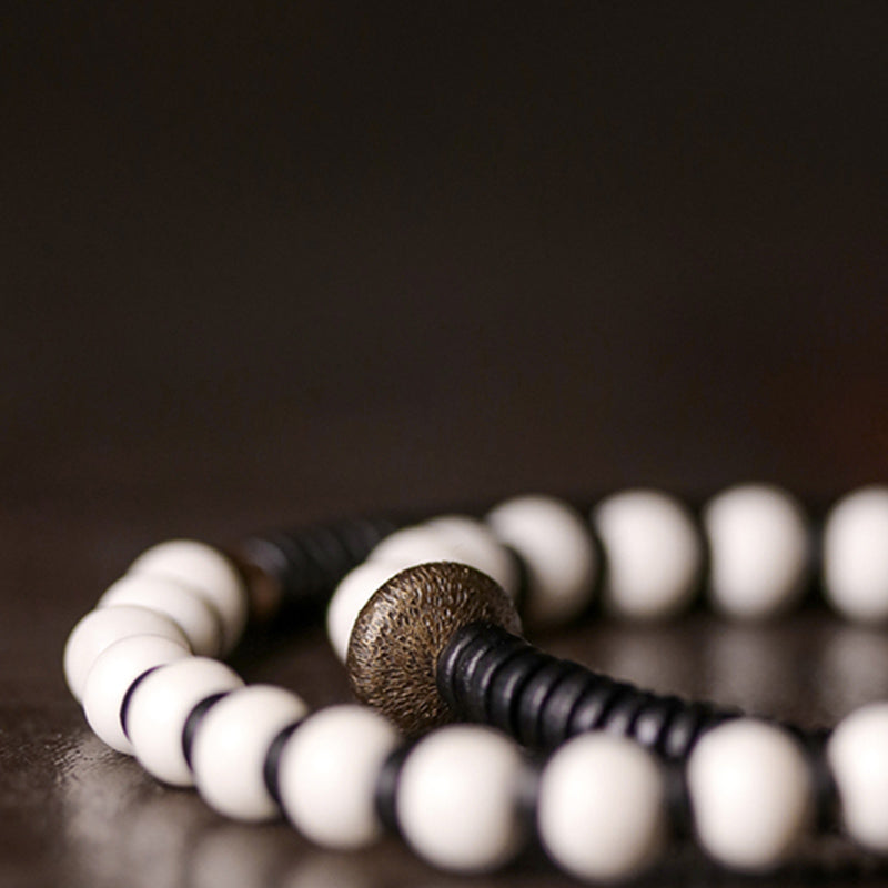 Bracelet couple force en bois d'ébène et cuivre, perles d'os et Buddha Stones