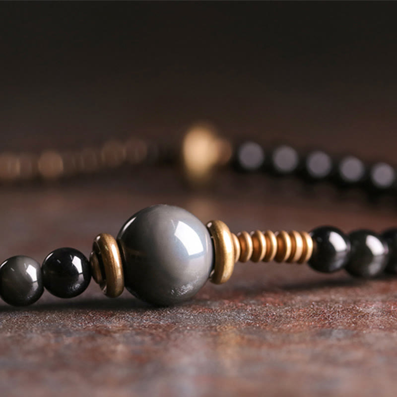Bracelet multicouche positif en cuivre et bois d'ébène avec Buddha Stones arc-en-ciel obsidienne