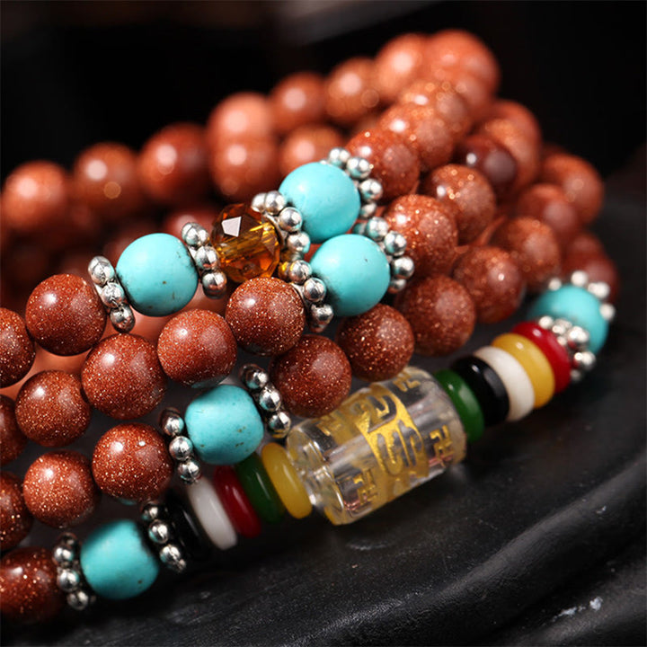 Bracelet de confiance avec 108 perles Mala en Buddha Stones Goldstone Om Mani Padme Hum Swastika
