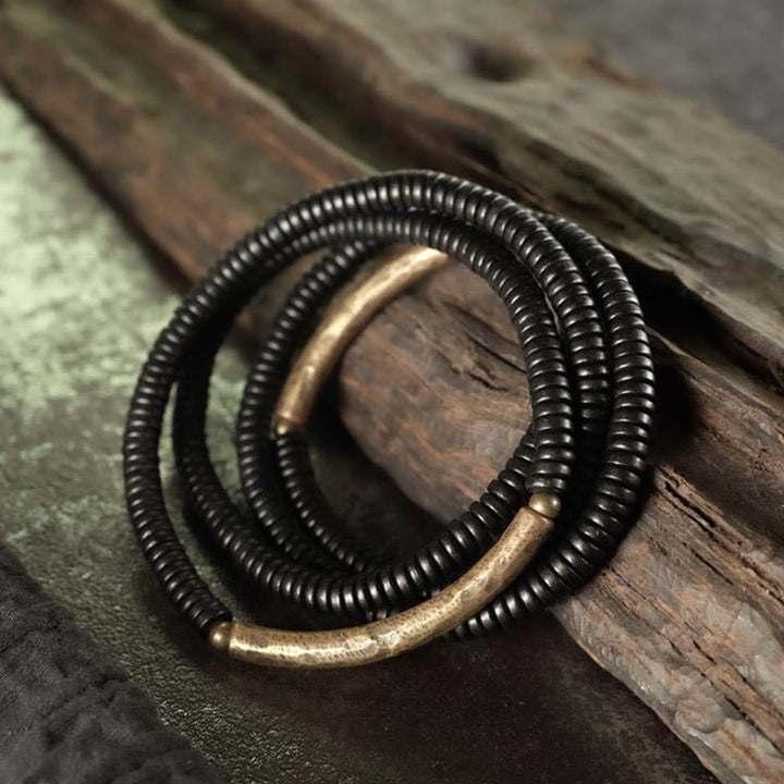 Bracelet multicouches en bois d'ébène et cuivre avec Buddha Stones
