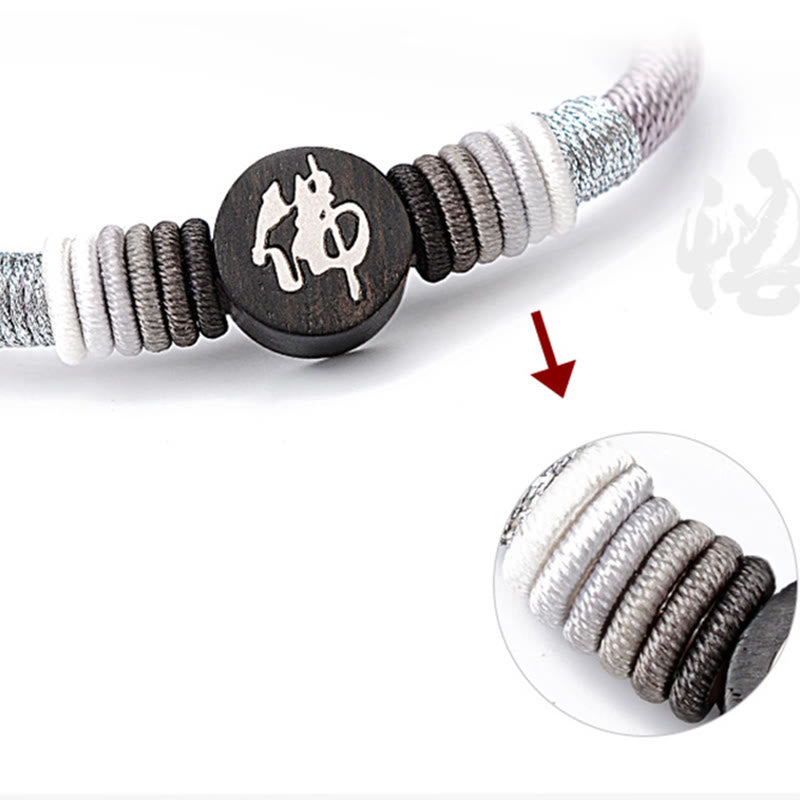 Bracelet en corde fait main en ébène avec personnage de Bouddha de Buddha Stones