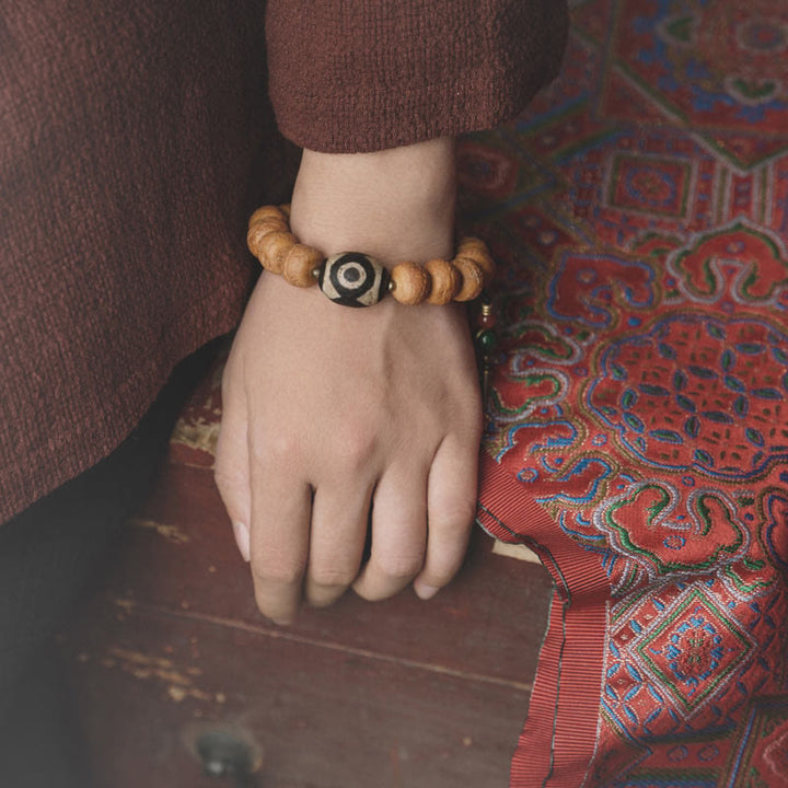 Bracelet Mala en perles de graines de Bodhi Dzi en pierres de Buddha Stones tibétaines avec breloque de paix