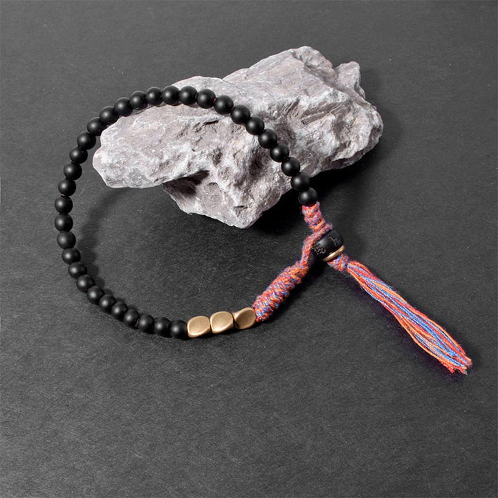Bracelet à pampilles en onyx noir tibétain fait main avec Buddha Stones
