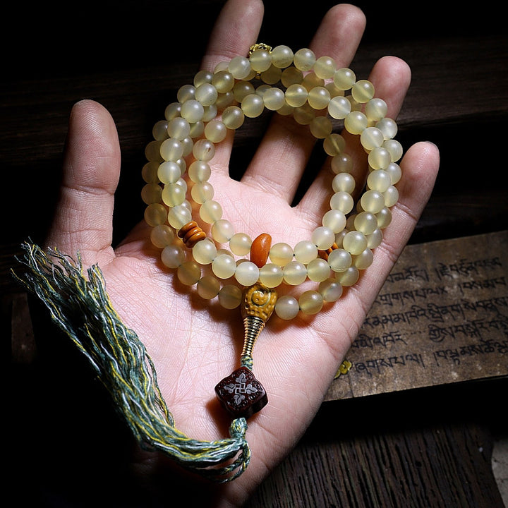 Bracelet porte-bonheur en ambre avec 108 Buddha Stones de Mala en corne de mouton du Tibet