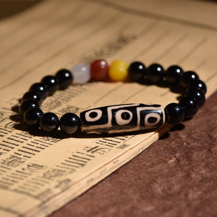 Bracelet de pouvoir de richesse en perles dzi naturelles tibétaines à neuf yeux Buddha Stones