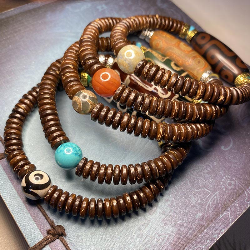 Bracelet de richesse en perles tibétaines à neuf yeux Dzi Buddha Stones
