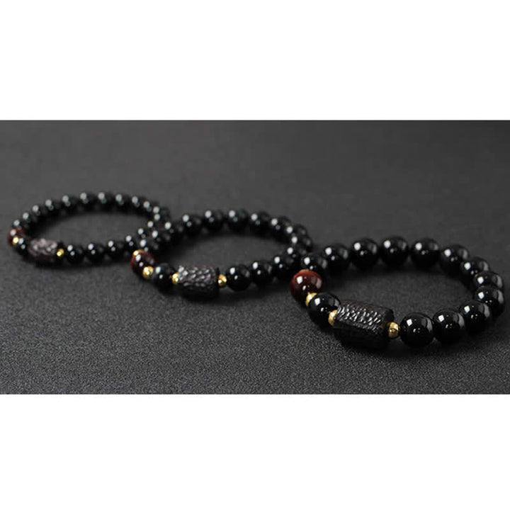 Bracelet de couple en obsidienne noire et bois d'ébène avec œil de tigre rouge
