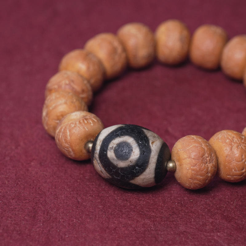 Bracelet Mala en perles de graines de Bodhi Dzi en pierres de Buddha Stones tibétaines avec breloque de paix