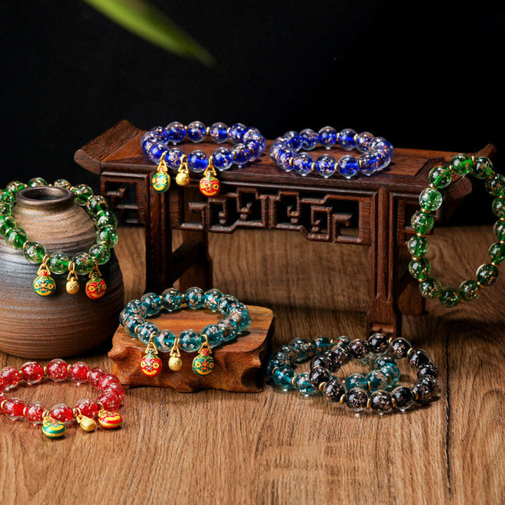 Bracelet de réussite en perles de verre Liuli fluorescentes lumineuses avec breloque de famille de bêtes avaleuses en or et Buddha Stones