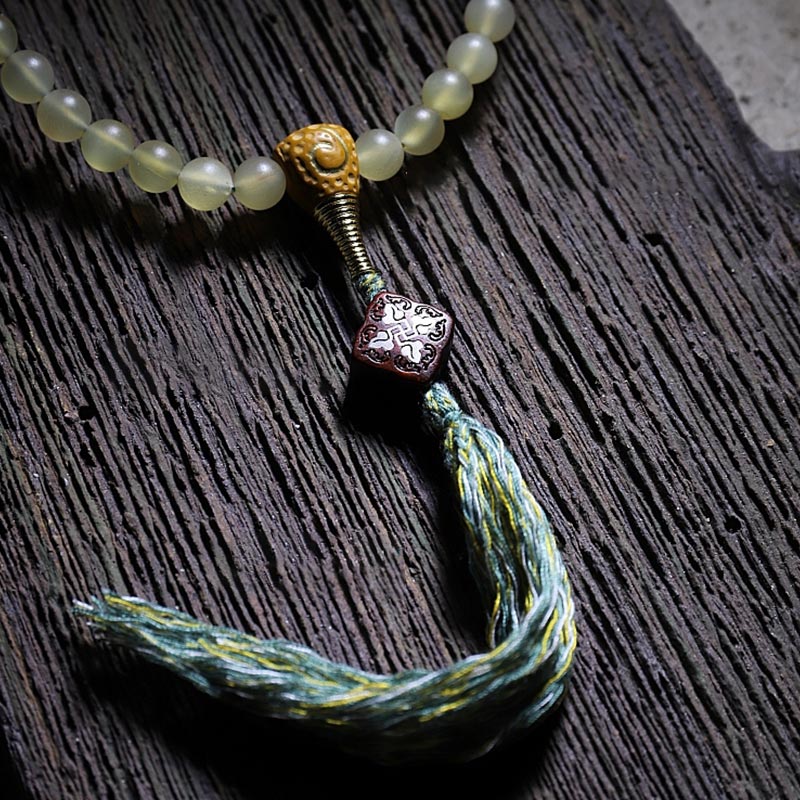 Bracelet porte-bonheur en ambre avec 108 Buddha Stones de Mala en corne de mouton du Tibet