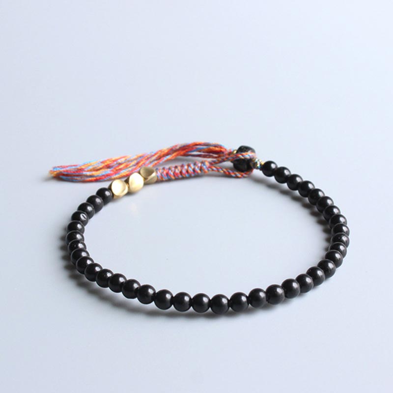 Bracelet à pampilles en onyx noir tibétain fait main avec Buddha Stones