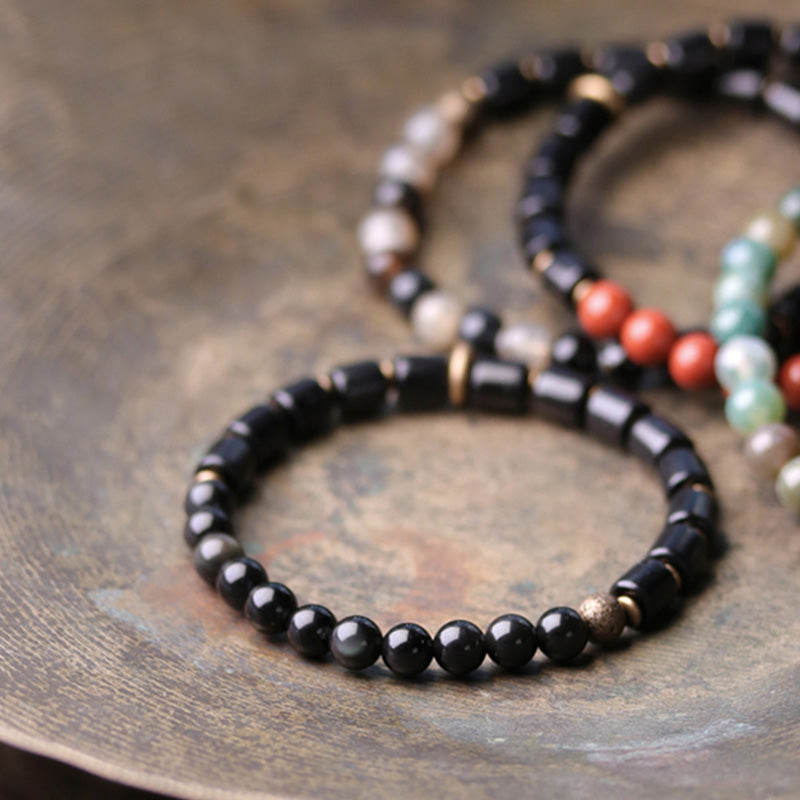 Bracelet couple paix Buddha Stones bois d'ébène jaspe rouge mousse agate cristal cuivre