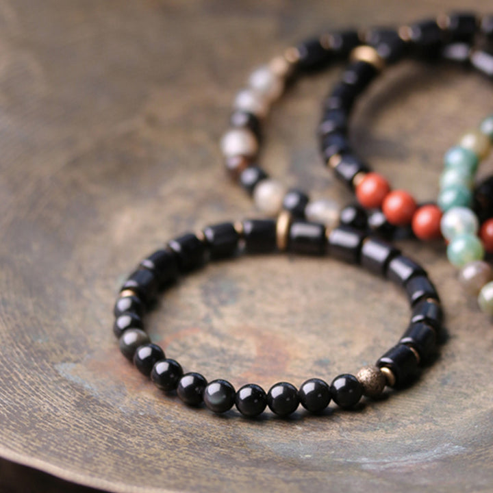 Bracelet couple paix Buddha Stones bois d'ébène jaspe rouge mousse agate cristal cuivre