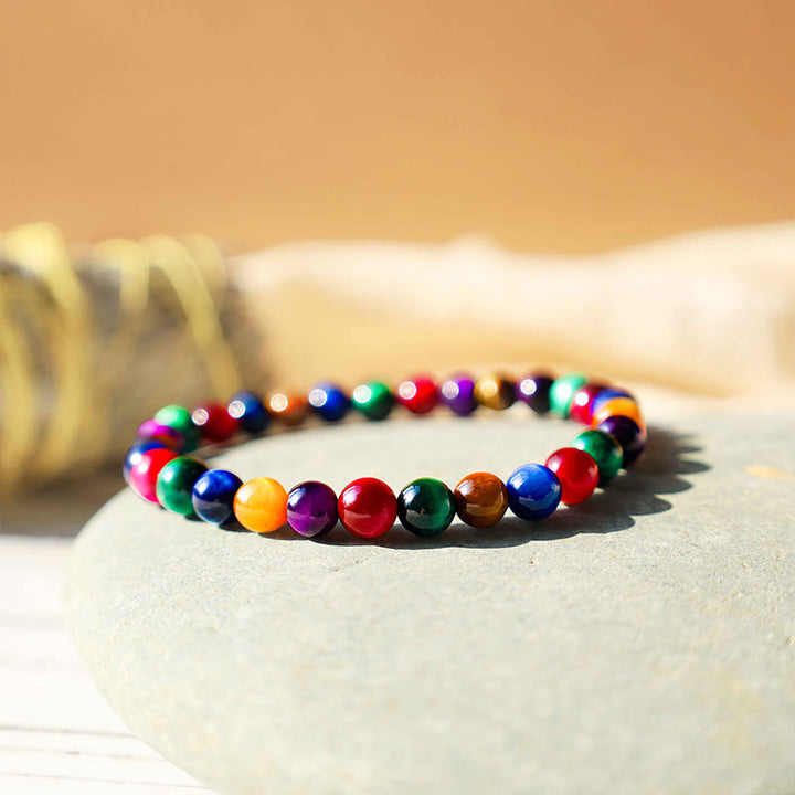Bracelet courageux et résolu en œil de tigre avec Buddha Stones