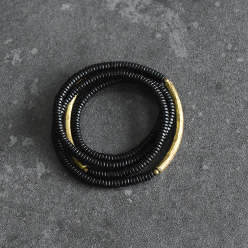 Bracelet multicouches en bois d'ébène et cuivre avec Buddha Stones